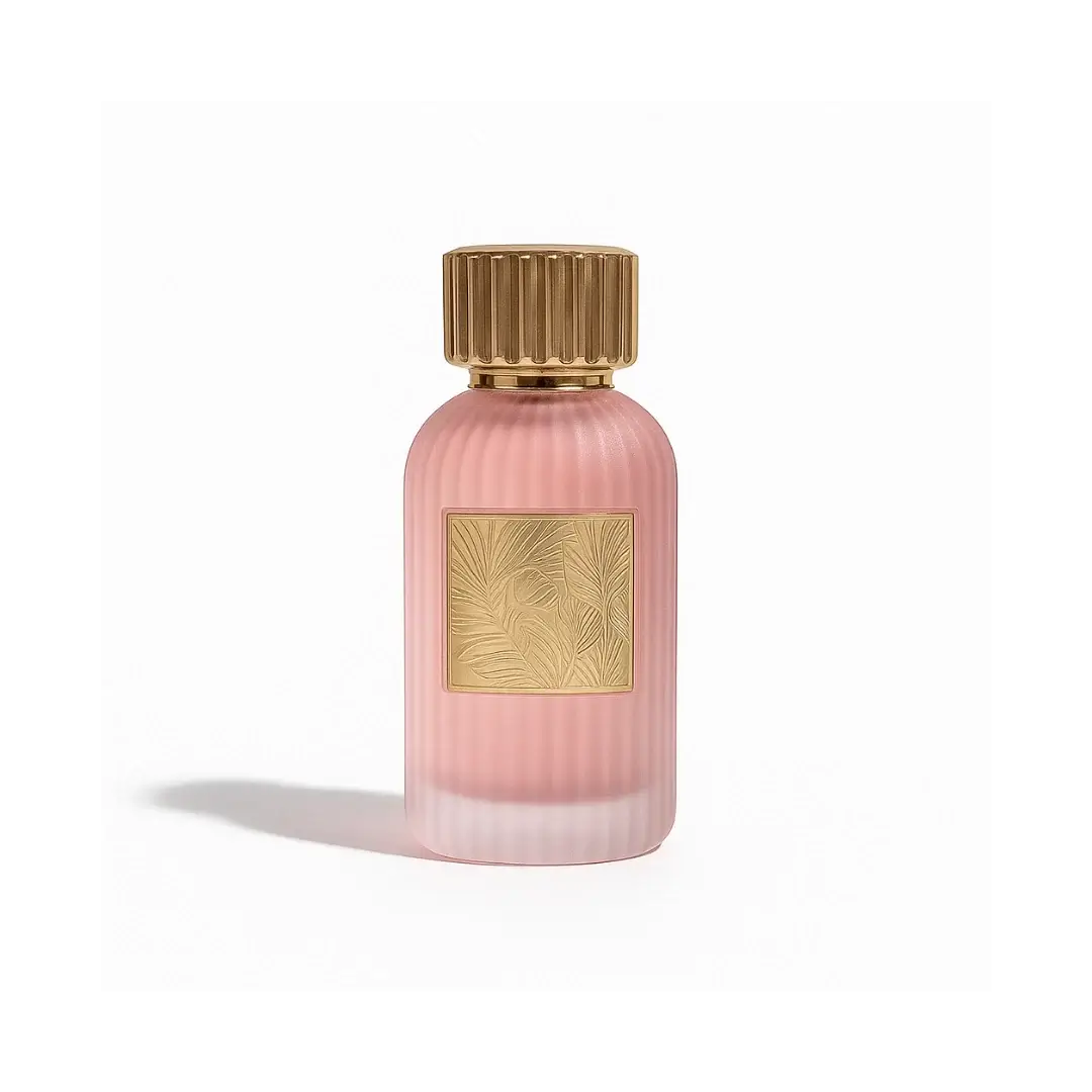 Qissa Pink Perfume 100ml bottle with golden cap and textured design.