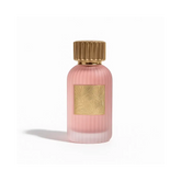 Qissa Pink Perfume 100ml bottle with golden cap and textured design.
